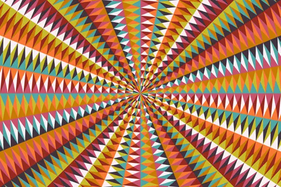 Radiating pattern of triangles arranged in a large quadrilateral, with pattern of warm colors and light blue and green.