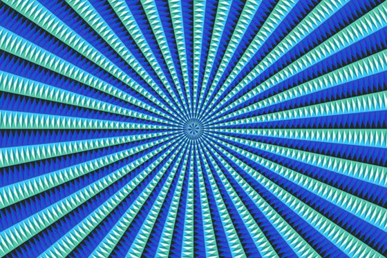 Radiating pattern of triangles arranged in a large quadrilateral, with pattern of blue and light blue. Pattern creates strong outward rays.